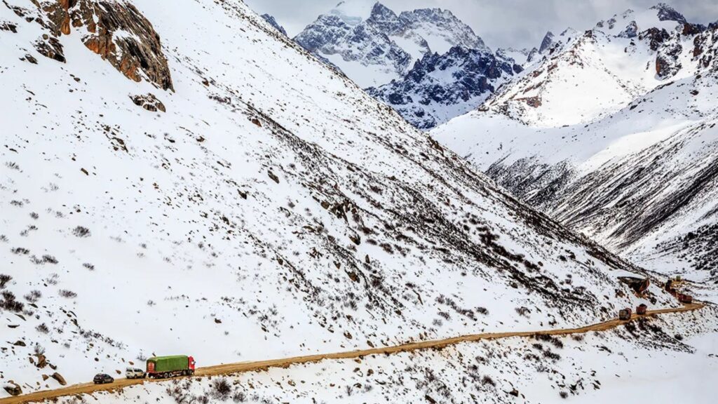 winding road which connects Sichuan with Tibet, on the snow-covered Queer mountain in Dege county, Ganzi